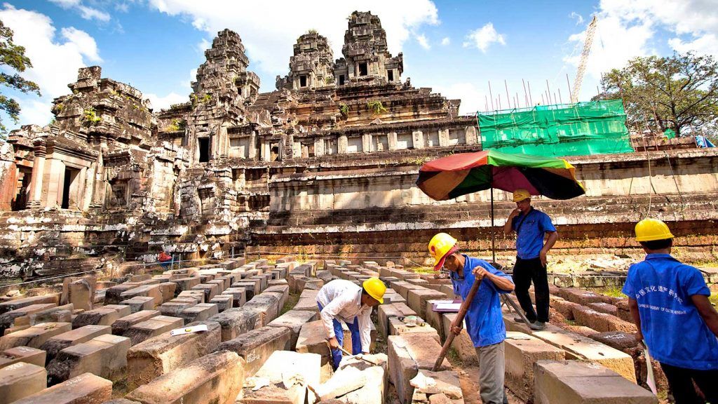 Workers cleaning in Angkor Wat, Siem Reap - Most visited religious temple in South East Asia